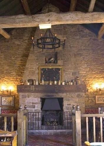 One of the big stone fireplaces under the old beams